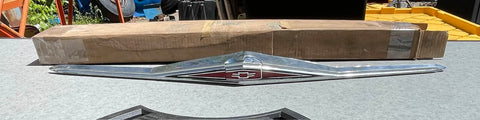 NOS 1965 CORVAIR FRONT GRILL BAR RED CENTER EMBLEM - 1 YR ONLY #3870728
